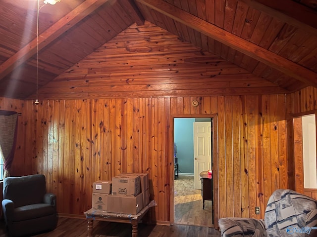sitting room featuring wood finished floors, vaulted ceiling with beams, wooden walls, and wooden ceiling