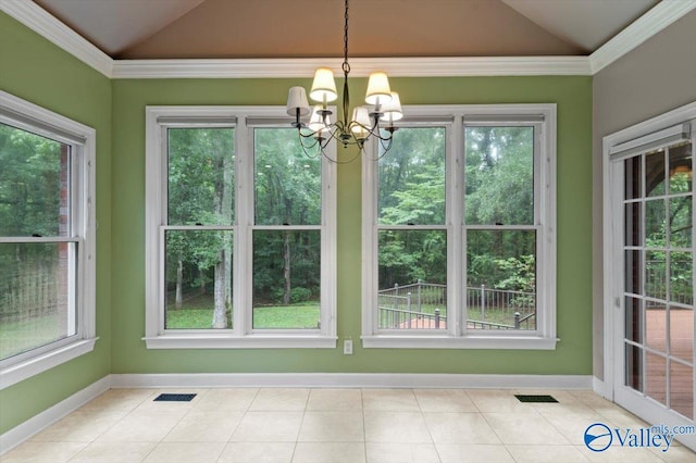 interior space with lofted ceiling, a notable chandelier, and a wealth of natural light