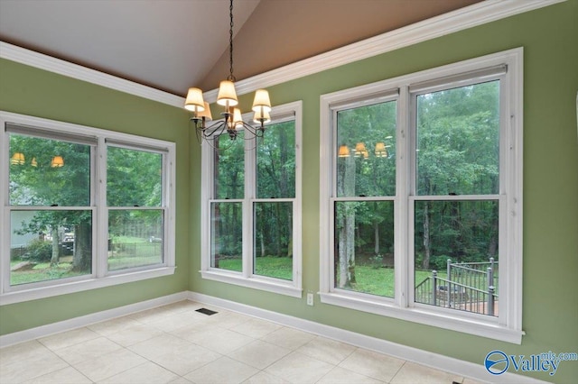 unfurnished dining area with an inviting chandelier, light tile patterned floors, crown molding, and vaulted ceiling