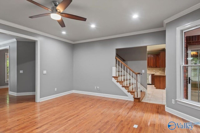 unfurnished living room with crown molding, light hardwood / wood-style floors, and ceiling fan