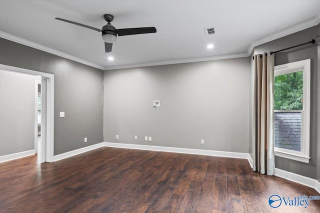 spare room with crown molding, a wealth of natural light, dark wood-type flooring, and ceiling fan