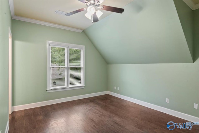 additional living space with ceiling fan, dark hardwood / wood-style floors, and vaulted ceiling