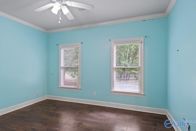 empty room featuring crown molding, dark wood-type flooring, a wealth of natural light, and ceiling fan