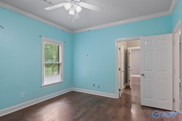 spare room featuring crown molding, ceiling fan, and dark hardwood / wood-style floors