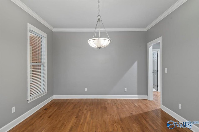 unfurnished room with crown molding and hardwood / wood-style floors