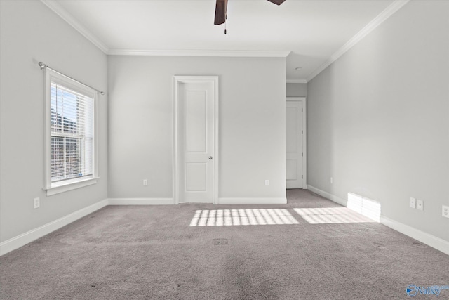 unfurnished bedroom with carpet floors, a ceiling fan, baseboards, and crown molding