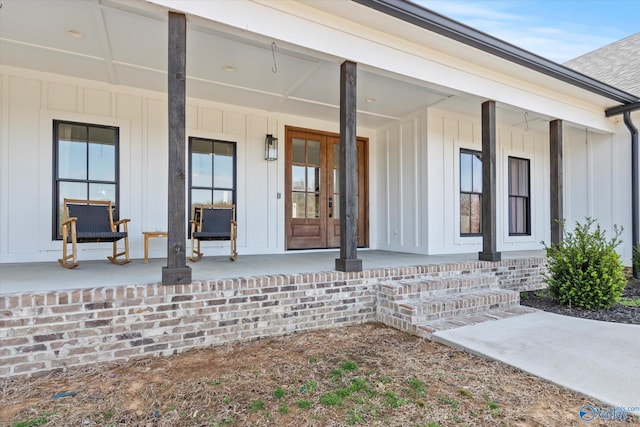 property entrance with a porch and board and batten siding