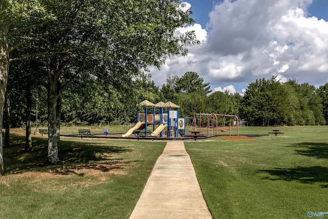 community play area featuring a lawn