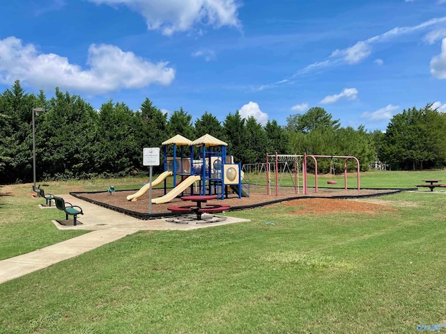 community playground featuring a lawn