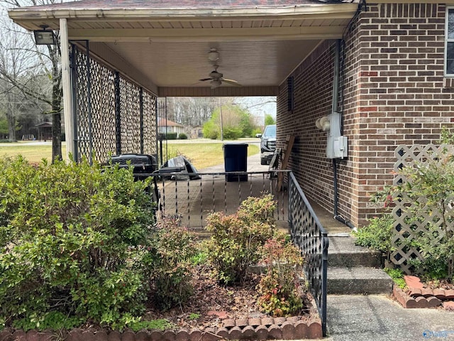 exterior space featuring a carport and ceiling fan