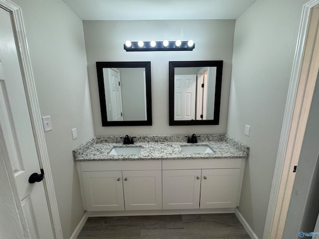 bathroom featuring hardwood / wood-style floors and vanity