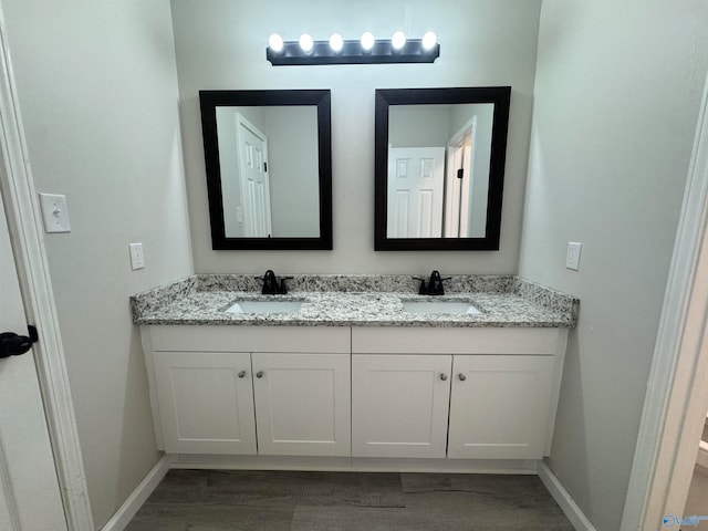 bathroom with wood-type flooring and vanity