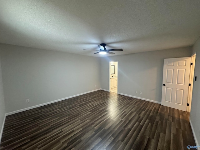 unfurnished room featuring dark wood-type flooring, a textured ceiling, and ceiling fan