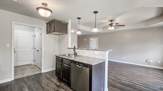 kitchen with a sink, baseboards, ceiling fan, and stainless steel dishwasher