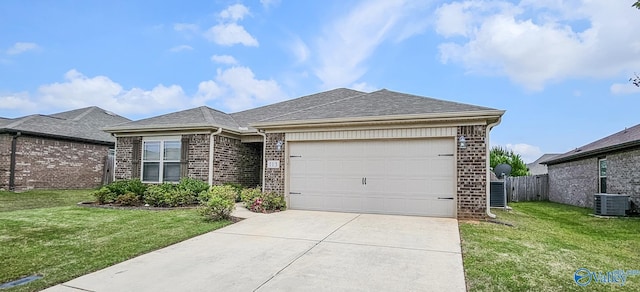 ranch-style home with central air condition unit, brick siding, a front lawn, concrete driveway, and an attached garage