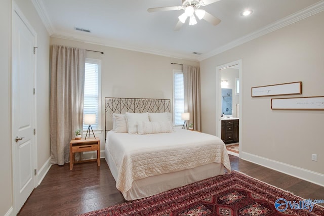 bedroom with crown molding, dark hardwood / wood-style floors, ensuite bathroom, and ceiling fan