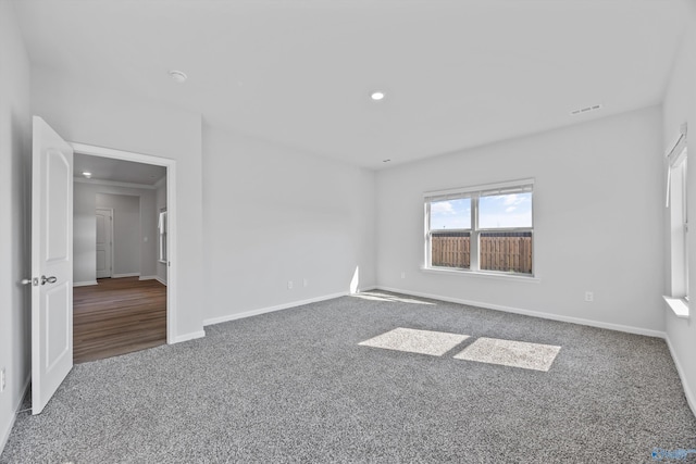 unfurnished bedroom with recessed lighting, carpet, and baseboards