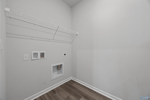 laundry room with electric dryer hookup, washer hookup, dark wood-style floors, baseboards, and laundry area