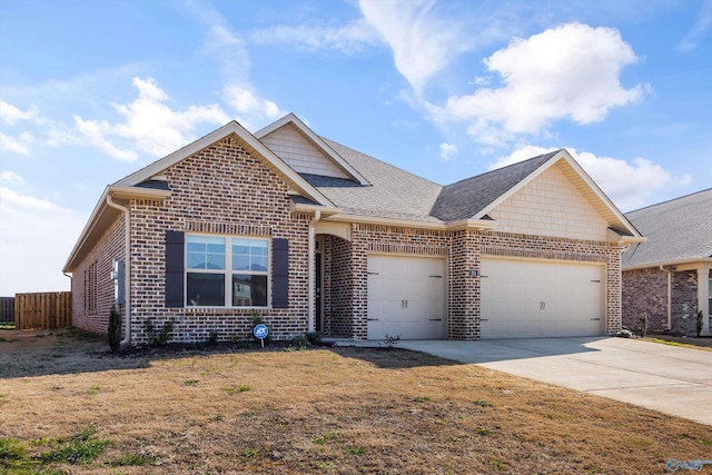 view of front of property with fence, driveway, roof with shingles, an attached garage, and brick siding