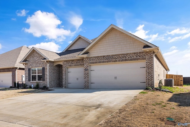 ranch-style home with brick siding, fence, concrete driveway, central AC unit, and a garage