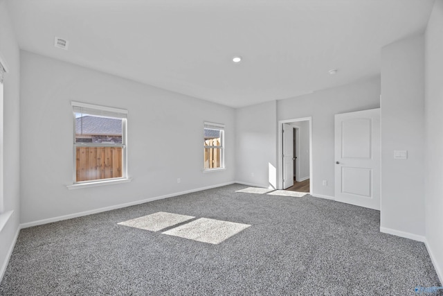 interior space with visible vents, baseboards, and carpet