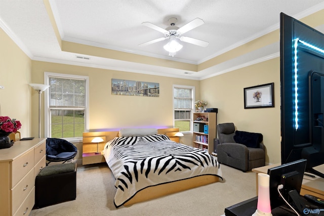 663 Gooch Ln, Madison, AL 35758 - bedroom with crown molding, a tray ceiling, carpet floors, and ceiling fan