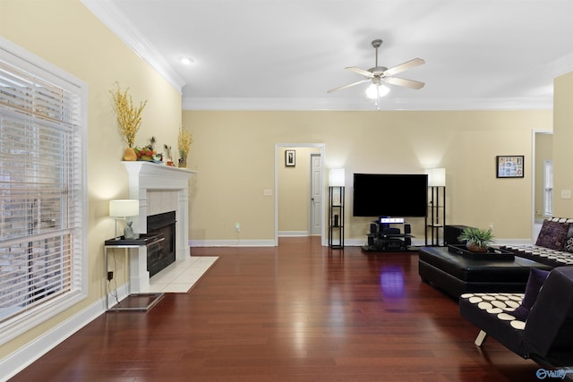 663 Gooch Ln, Madison, AL 35758 - living room featuring crown molding, wood finished floors, ceiling fan, a fireplace, and baseboards
