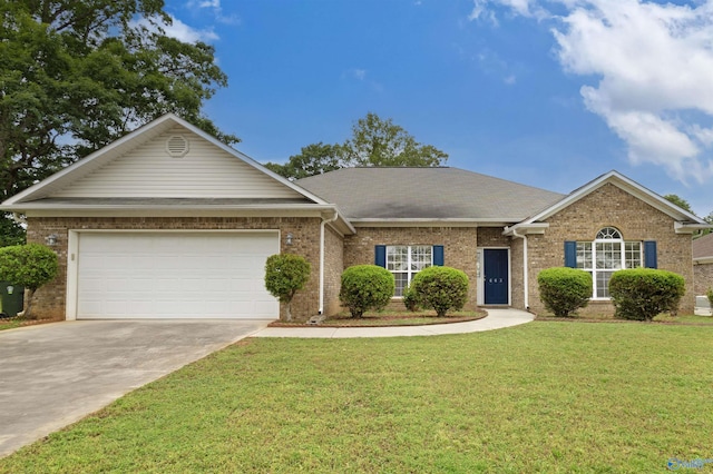 663 Gooch Ln, Madison, AL 35758 - view of front of property with brick siding, driveway, an attached garage, and a front yard