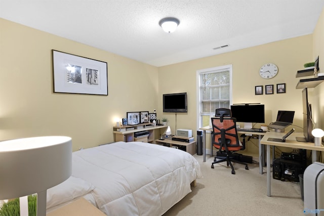 663 Gooch Ln, Madison, AL 35758 - carpeted bedroom featuring a desk and a textured ceiling