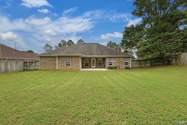 663 Gooch Ln, Madison, AL 35758 - back of property with a patio and brick siding