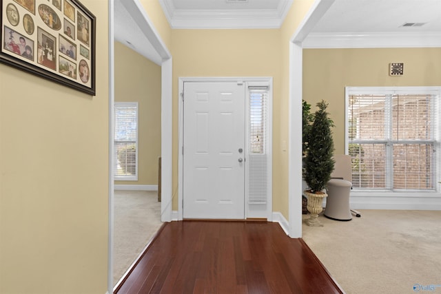 663 Gooch Ln, Madison, AL 35758 - foyer entrance with dark wood-type flooring, baseboards, ornamental molding, and plenty of natural light