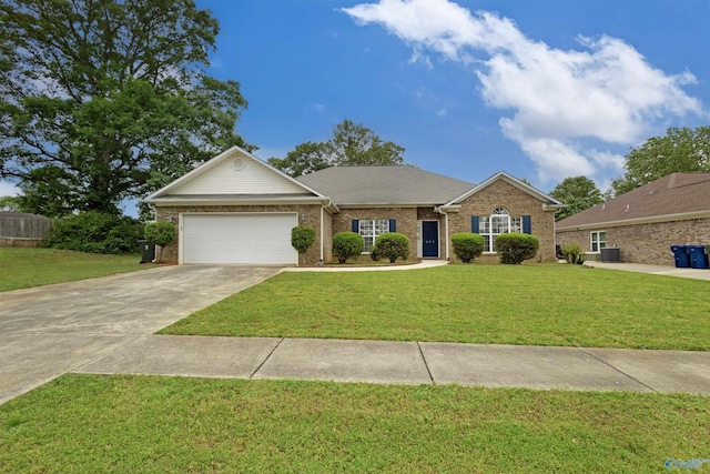 663 Gooch Ln, Madison, AL 35758 - view of front facade featuring concrete driveway, a front yard, a garage, and brick siding