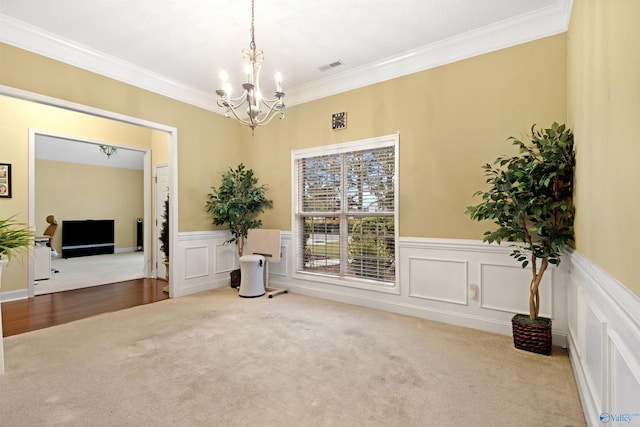 663 Gooch Ln, Madison, AL 35758 - unfurnished room with carpet, a chandelier, ornamental molding, and a wainscoted wall