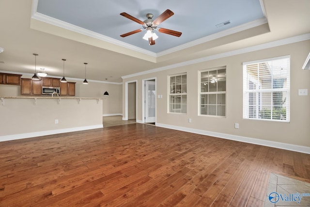 164 Moore Farm Cir NW, Huntsville, AL 35806 - unfurnished living room featuring visible vents, ceiling fan, and a tray ceiling