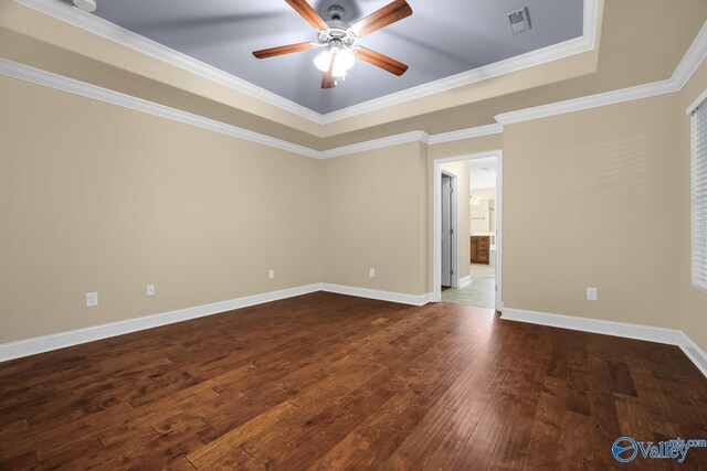 164 Moore Farm Cir NW, Huntsville, AL 35806 - empty room featuring visible vents, a ceiling fan, dark wood finished floors, and a tray ceiling