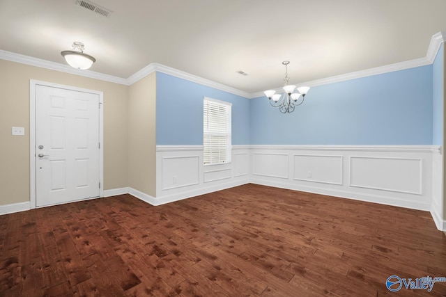 164 Moore Farm Cir NW, Huntsville, AL 35806 - foyer with a notable chandelier, visible vents, a wainscoted wall, and dark wood-type flooring