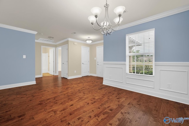 164 Moore Farm Cir NW, Huntsville, AL 35806 - unfurnished dining area with crown molding, a chandelier, wainscoting, and dark wood-type flooring