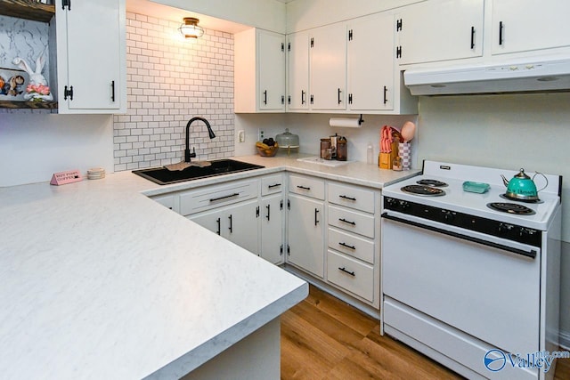 kitchen featuring white cabinetry, sink, light hardwood / wood-style flooring, and white electric range oven