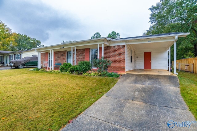 ranch-style house with a carport and a front lawn