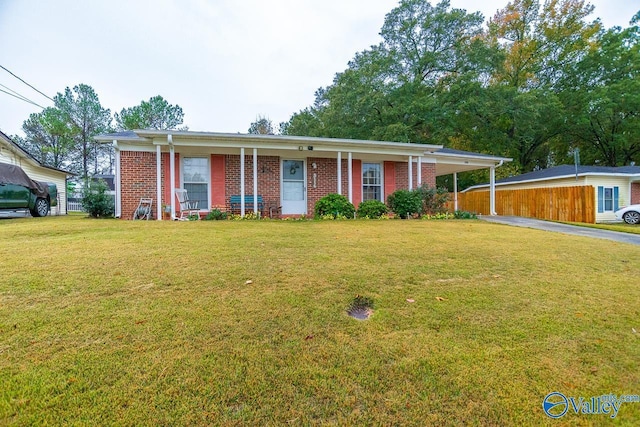 single story home featuring a carport and a front yard