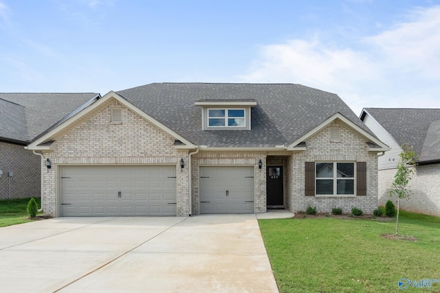 craftsman house with a front yard and a garage