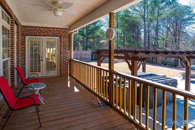 deck with fence and a ceiling fan