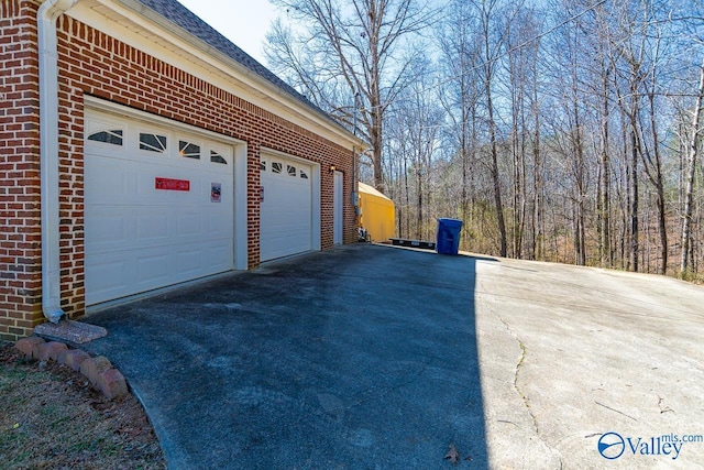 garage featuring driveway