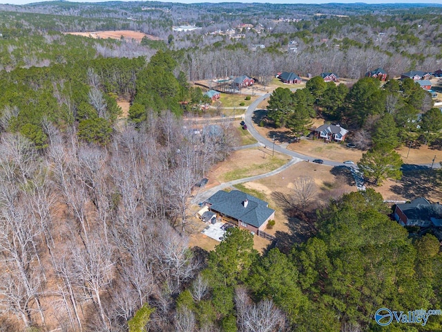 bird's eye view featuring a forest view