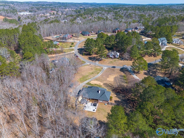 aerial view featuring a wooded view