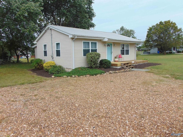 single story home featuring a front yard