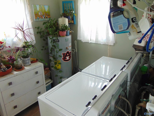 laundry area with washer and clothes dryer and gas water heater