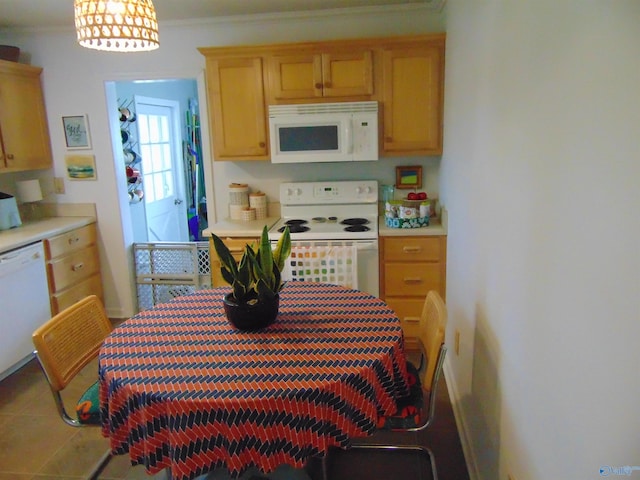 kitchen featuring white appliances, ornamental molding, and tile patterned floors