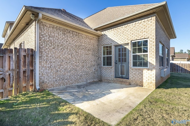 exterior space featuring a lawn and a patio