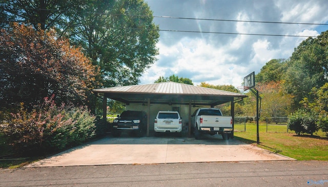 view of parking / parking lot with a lawn and a carport